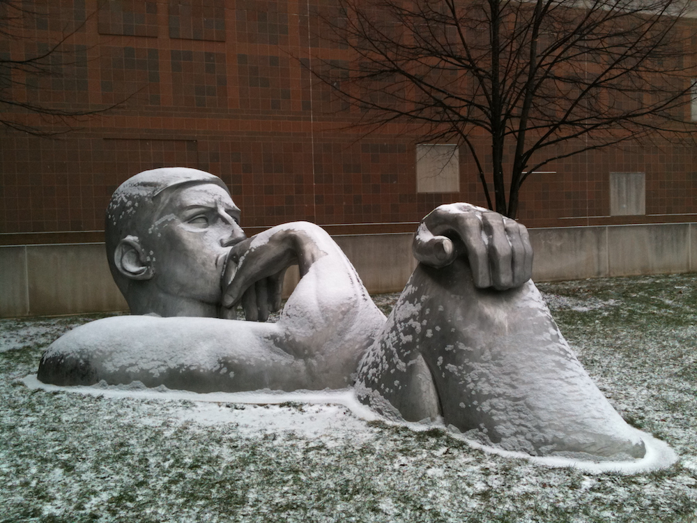 The Thinker
            statue outside Olscamp Hall, after a light snowfall.