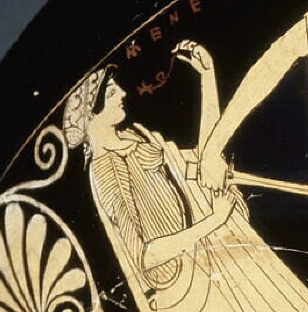 detail of the preceding image, centering on the woman on the left and the magical instrument in her left hand