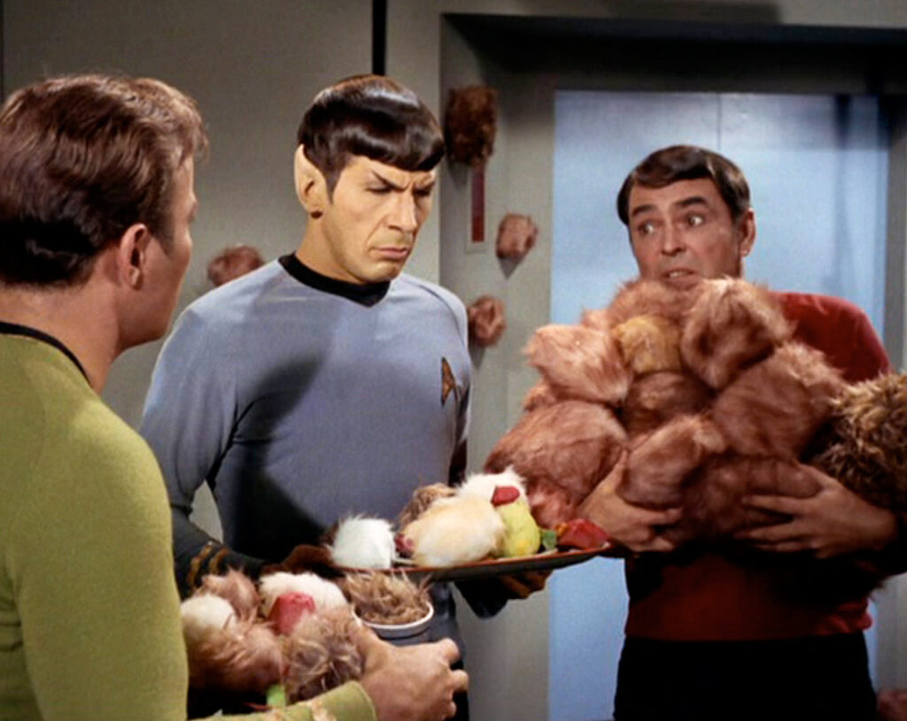 Captain Kirk (William Shatner), Science Officer Spock (Leonard Nimoy), Chief Engineer Scott (James Doohan), and a buttload of tribbles.