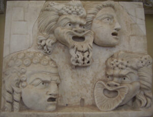 relief carvings of Roman theatrical masks: two comic, two possibly tragic